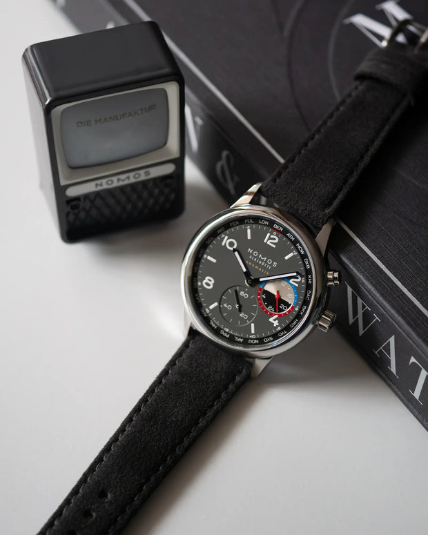 Alcantara® 9 to 5 on NOMOS Club Sport neomatik Worldtimer Volcano – lifestyle shot, front view